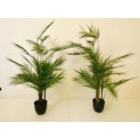 FAUX PALM TREES, a pair, 110cm H x 60cm D approx., potted. (2)