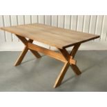 FARMHOUSE DINING TABLE, rectangular planked pine raised upon 'X' trestles united by a stretcher,
