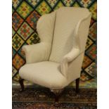 WING ARMCHAIR, 115cm H x 86cm W, Georgian design mahogany in new ticking upholstery.