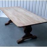 REFECTORY DINING TABLE, round rectangular oak, planked and raised upon shaped trestle supports