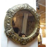 WALL MIRROR, 62cm x 68cm late 19th century/early 20th century circular brass with fruit and
