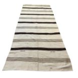 TURKISH KILIM, 332cm x 135cm, purchased from William Yeoward by repute.