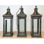 HANGING LANTERNS, a set of three, 62cm H metal with glazed panels. (3)