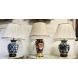 TABLE LAMPS, a pair, blue and white each overall 61cm tall including shades and one other with a