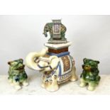 ASIAN CERAMICS, to include two elephant stands and a pair of dogs of foo, largest 39cm H x 50cm. (4)