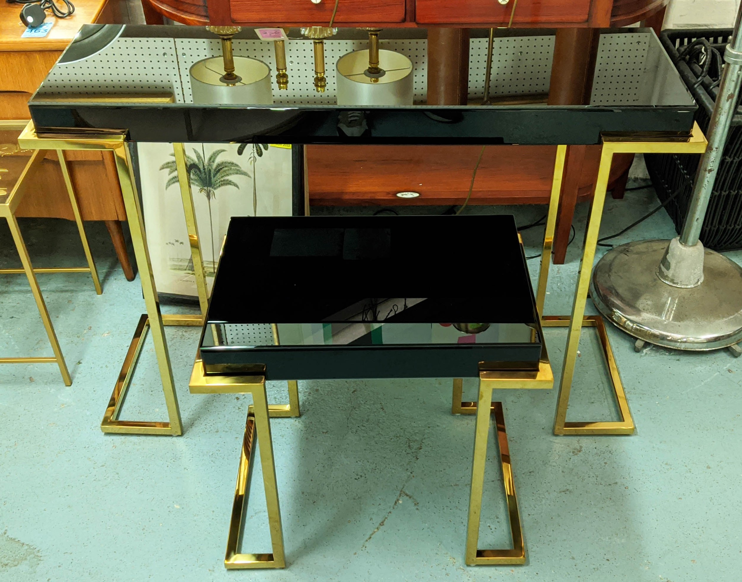 CONSOLE AND SIDE TABLE, Art Dec style, gilt metal and smoked glass, 116cm x 39cm x 80cm. (2)