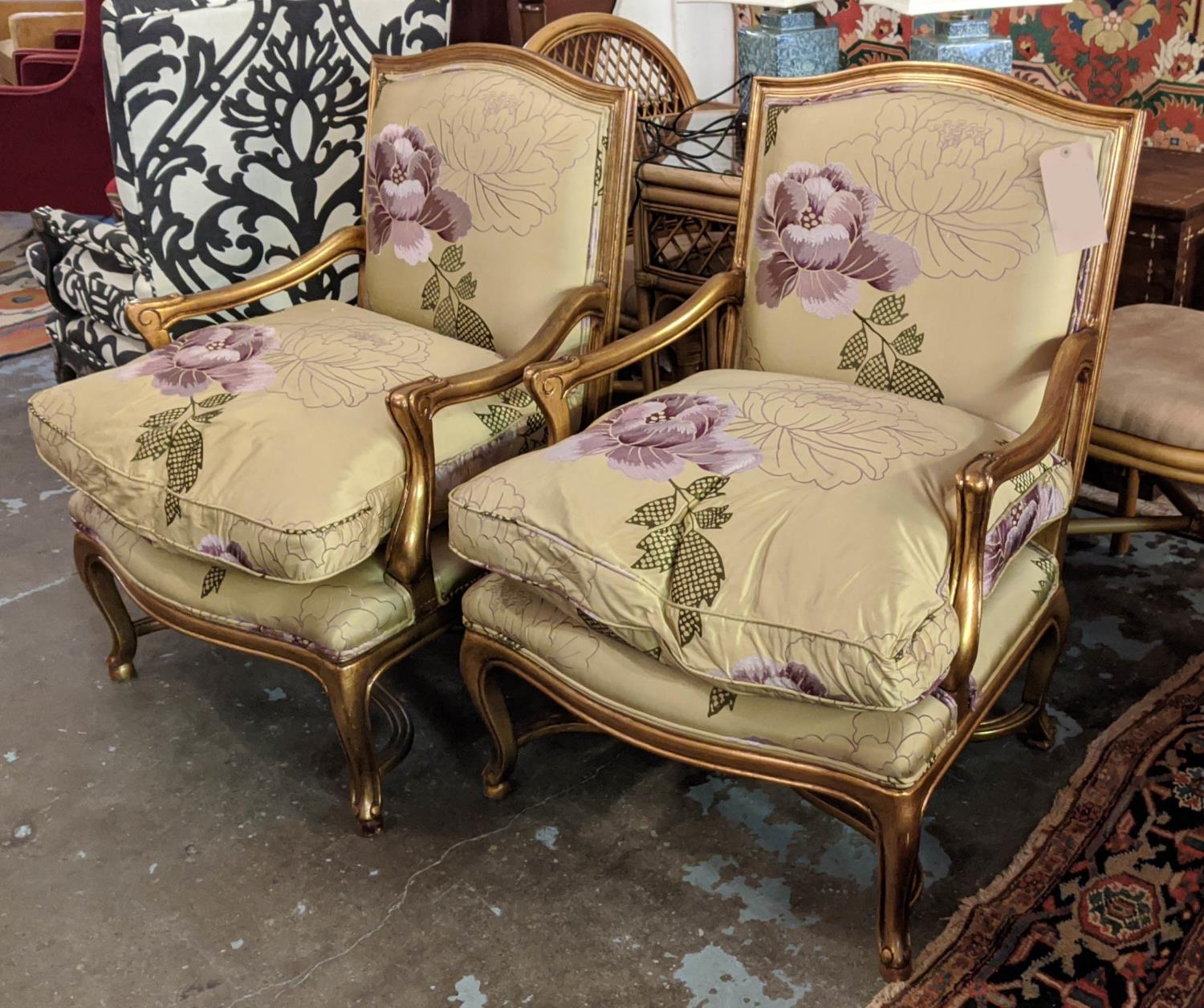 FAUTEUILS, a pair each 97cm W x 97cm H, reproduction in Louis XV style with gilt frames and silk