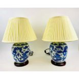 TABLE LAMPS, a pair Chinese Export style blue and white ceramic, pleated shades, 52cm high. (2)