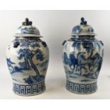 CHINESE LIDDED POTS, a pair, each 53cm H blue and white painted, depicting horses, modern. (2)