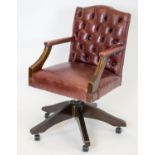 DESK CHAIR, 87cm x 54cm w, compact size in maroon leather with swivel seat and castors.