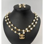 A CHANEL GILT METAL AND FAUX PEARL NECKLACE, 60cm long, together with a pair of gilt metal and