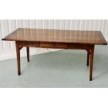 FARMHOUSE TABLE, 19th century French oak planked and cleated with square supports and frieze drawer,