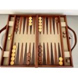 BACKGAMMON SET, 7cm x 23cm x 40cm, brown leathered, complete with accessories.