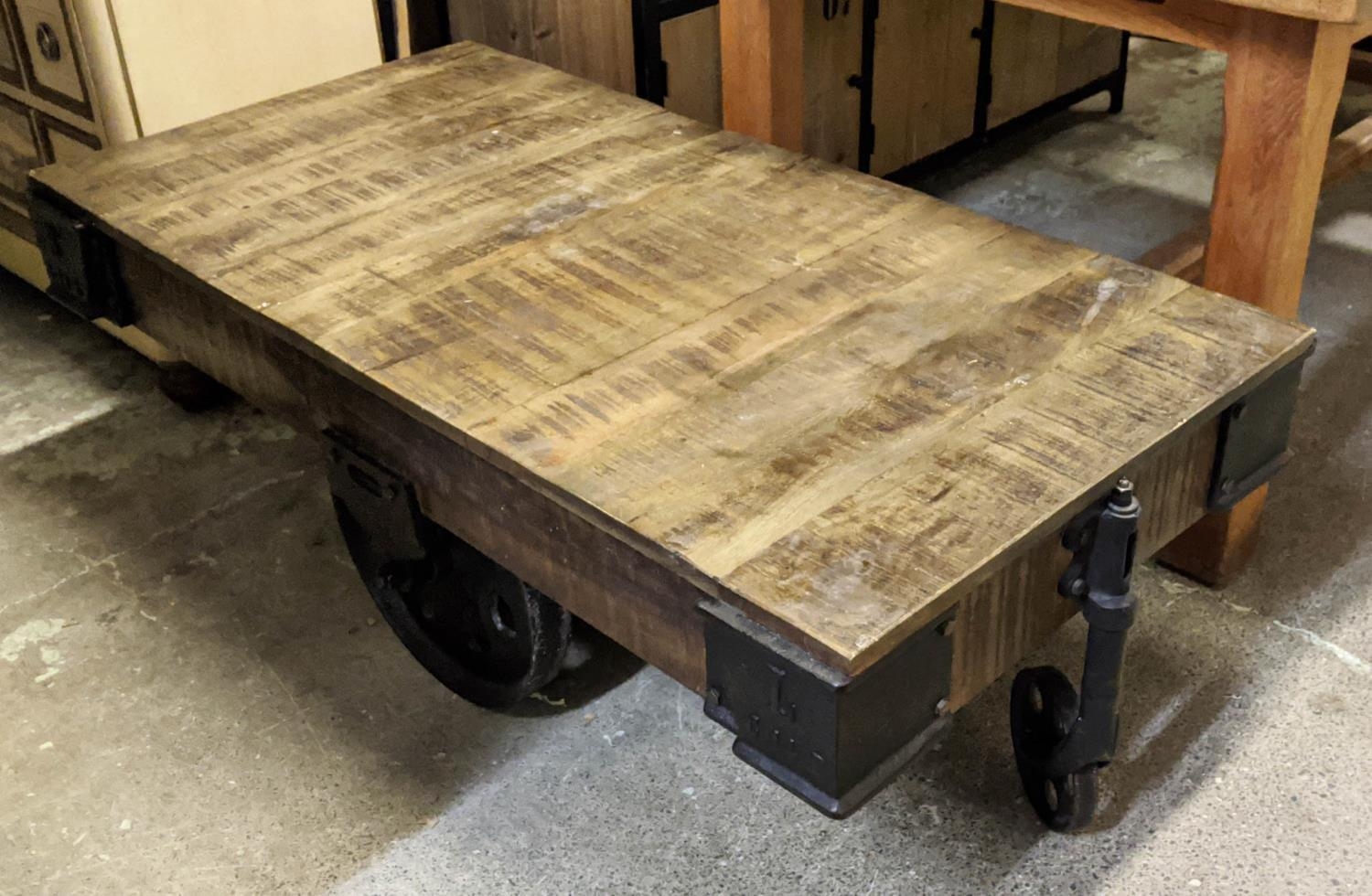 INDUSTRIAL STYLE COFFEE TABLE, 69cm x 134cm x 47cm H, on oversized castor base.