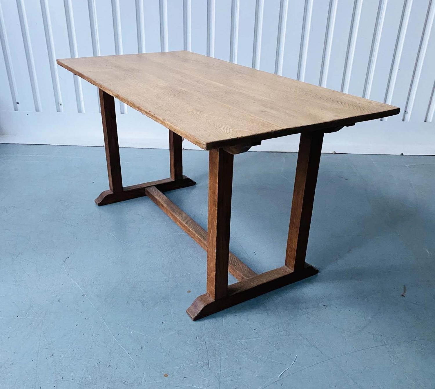 DINING TABLE, early 20th century oak restrained rectangular form raised upon simple double