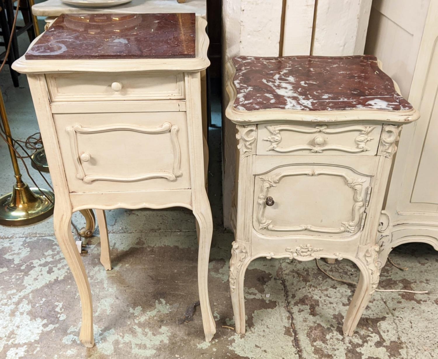 BEDSIDE CABINETS, two similar, cream painted, late 19th/early 20th century French one 84cm H, the