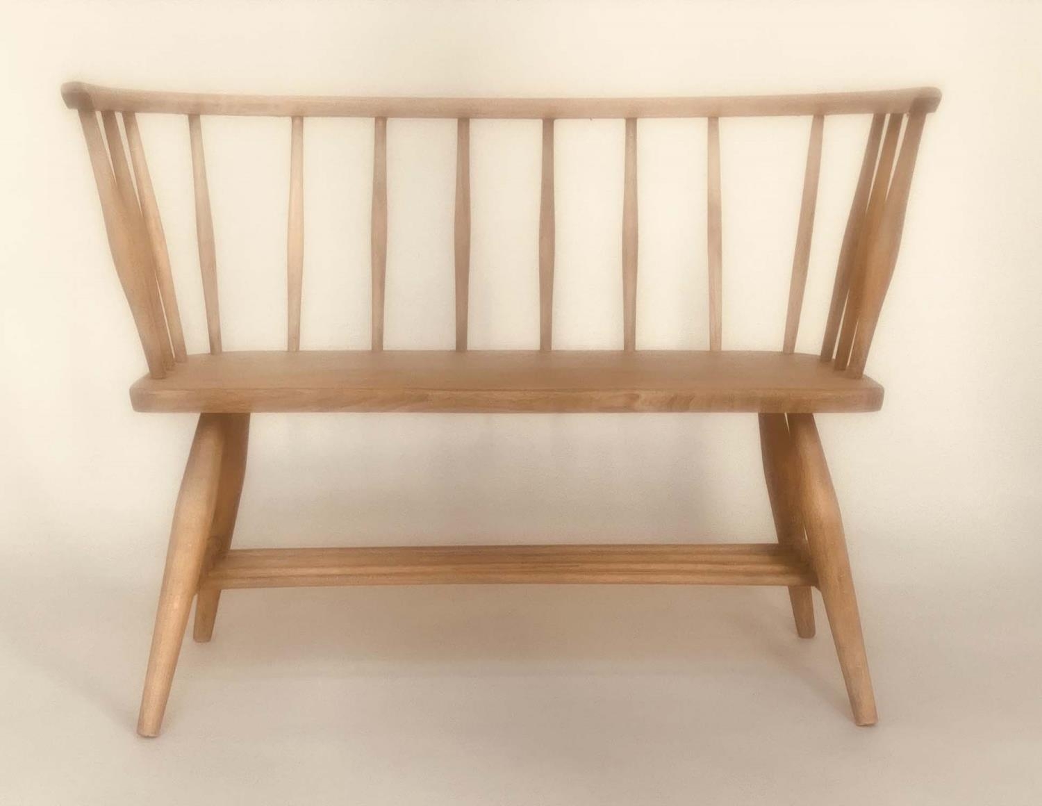 ERCOL STYLE HALL SEAT, mid 20th century elm, with enclosing rail back and solid seat in the manner