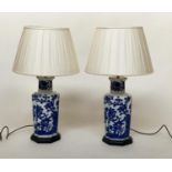 TABLE LAMPS, a pair, Chinese blue and white ceramic of jar form with foliate decoration, with