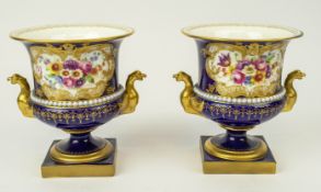 ROYAL WORCESTER CAMPANA VASES, a pair, decorated with hand painted floral sprays signed E. Phillips,