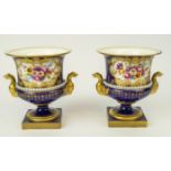 ROYAL WORCESTER CAMPANA VASES, a pair, decorated with hand painted floral sprays signed E. Phillips,