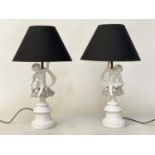 TABLE LAMPS, a pair, 20th century Italian white ceramic, each with seated cupid support (old