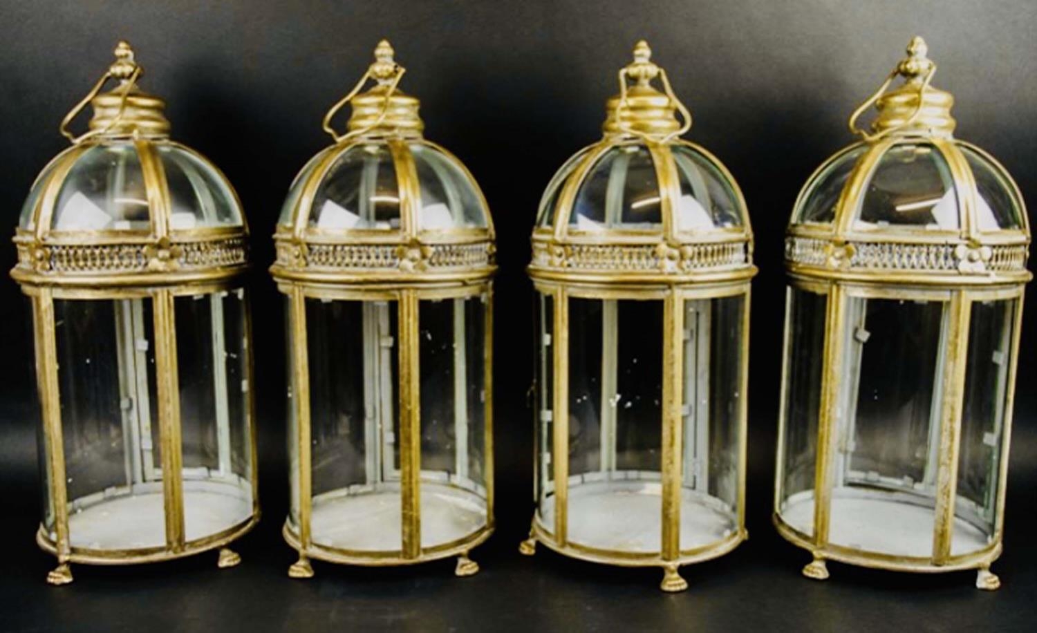 STORM LANTERNS, set of four, 46cm H x 19cm diam., Regency style, gilt metal. (4)