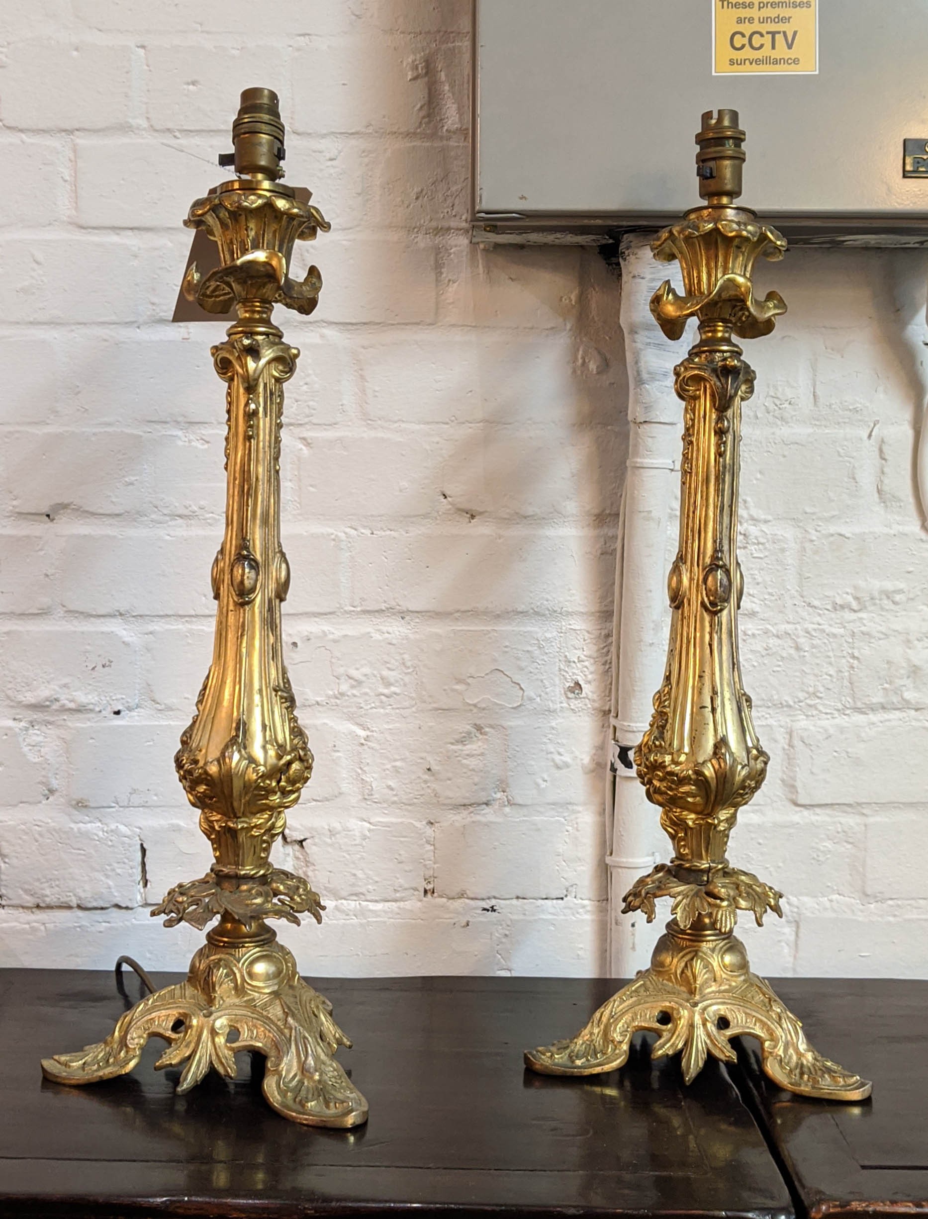 ORMOLU CANDLESTICKS, a pair, 59cm H converted into table lamps. (2)