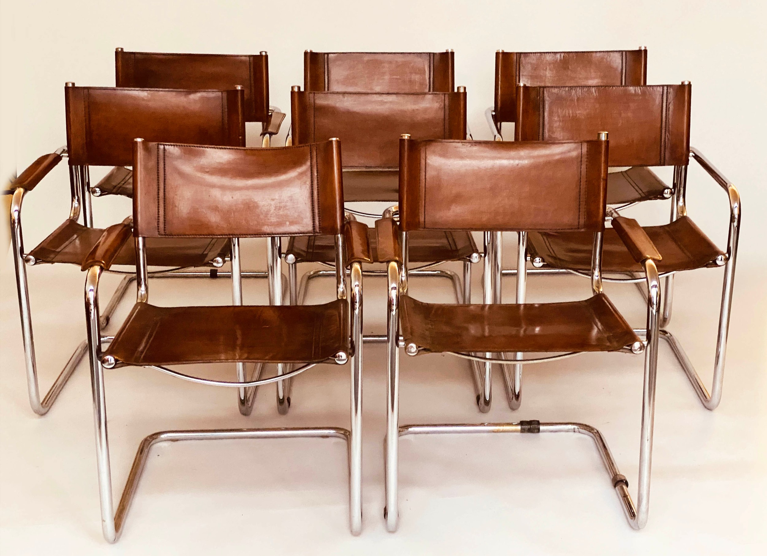 DINING ARMCHAIRS, eight Bauhaus design chrome cantilever armchairs with stitched tan leather