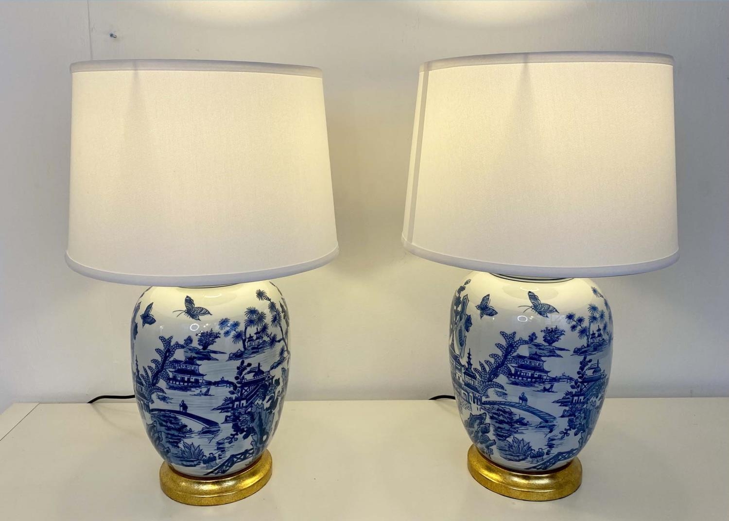 TABLE LAMPS, pair, 62cm H x 38cm diam., Chinese export style blue and white ceramic, neutral shades,
