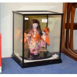 ORIENTAL STYLE DOLL IN DISPLAY CASE