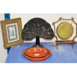 2 GRADUATED SLIPWARE DISHES, CAST IRON BOOK STAND, ORIENTAL GONG WITH BEATER & EASTERN FRAMED