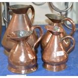 4 OLD GRADUATED COPPER JUGS