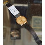 VINTAGE BUECHE-GIROD GENTS 9 CARAT GOLD CASED WRIST WATCH ON LEATHER STRAP
