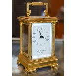 BRASS CASED CARRIAGE CLOCK BY WM WIDDOP, WITH KEY