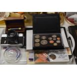 TRAY WITH CASED UK COIN SET, VARIOUS COMMEMORATIVE COINS, DECORATIVE PAPER WEIGHT, OLD CAMERA ETC