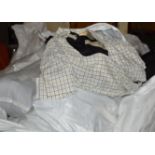 LARGE QUANTITY OF ASSORTED CLOTHING OVER VARIOUS BAGS