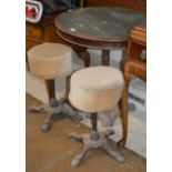 OLD CIRCULAR TABLE WITH CAST METAL BASE & PAIR OF SIMILAR PADDED STOOL