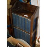 SMALL OAK BOOKCASE WITH SET OF DICKENS BOOKS