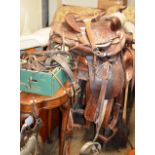VARIOUS LEATHER SADDLES WITH STAND & ACCESSORIES