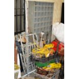 A LARGE QUANTITY OF VARIOUS OLD TOOLS, HAND SAWS, SHELF UNIT, EXTENSION CABLES, SACK BARROWS ETC