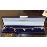9 CARAT GOLD CHARM BRACELET WITH PRESENTATION BOX - APPROXIMATE WEIGHT = 18.7 GRAMS