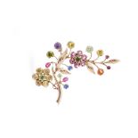 A multi-gem floral spray brooch