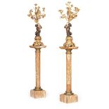 PAIR OF FRENCH GILT AND PATINATED BRONZE FIGURAL CANDELABRA, WITH ASSOCIATED ONYX PEDESTALS 19TH