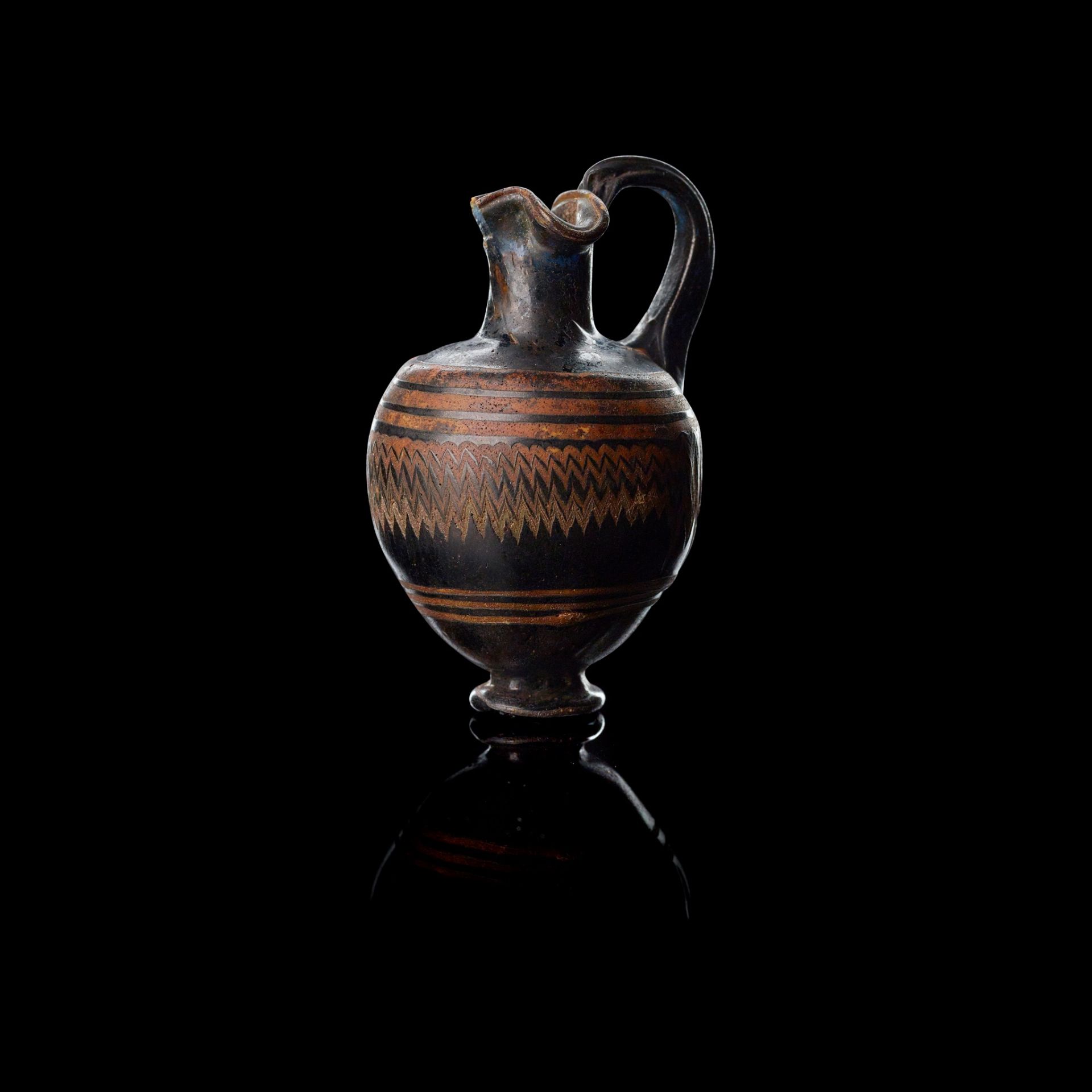 EASTERN MEDITERRANEAN MINIATURE CORE FORMED GLASS OINOCHOE 6TH - 5TH CENTURY BCE, 19TH C PROVENANCE - Image 2 of 2