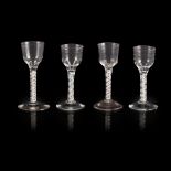 FOUR GEORGIAN OPAQUE-TWIST STEM WINE GLASSES MID 18TH CENTURY