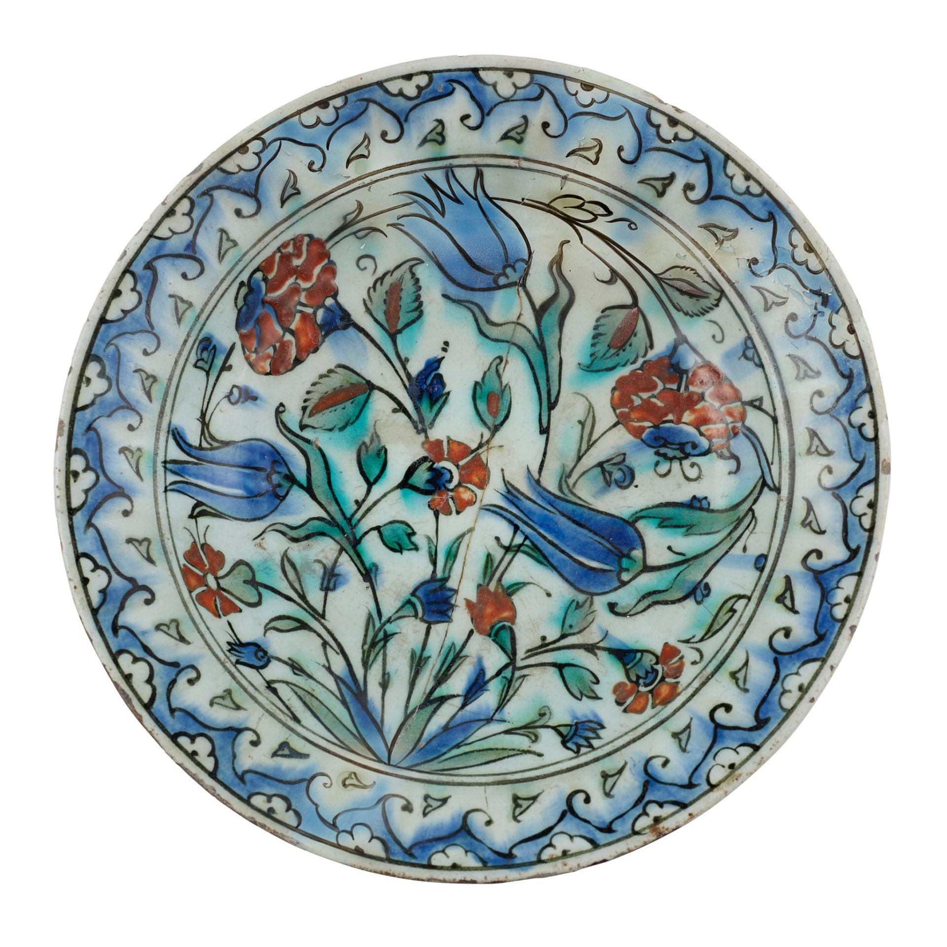 AN IZNIK POTTERY DISH WITH TULIPS, CARNATIONS AND ROSES OTTOMAN TURKEY, 17TH CENTURY
