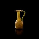 ROMAN GLASS AMBER JUG EUROPE OR NEAR EAST, 3RD - 4TH CENTURY A.D.