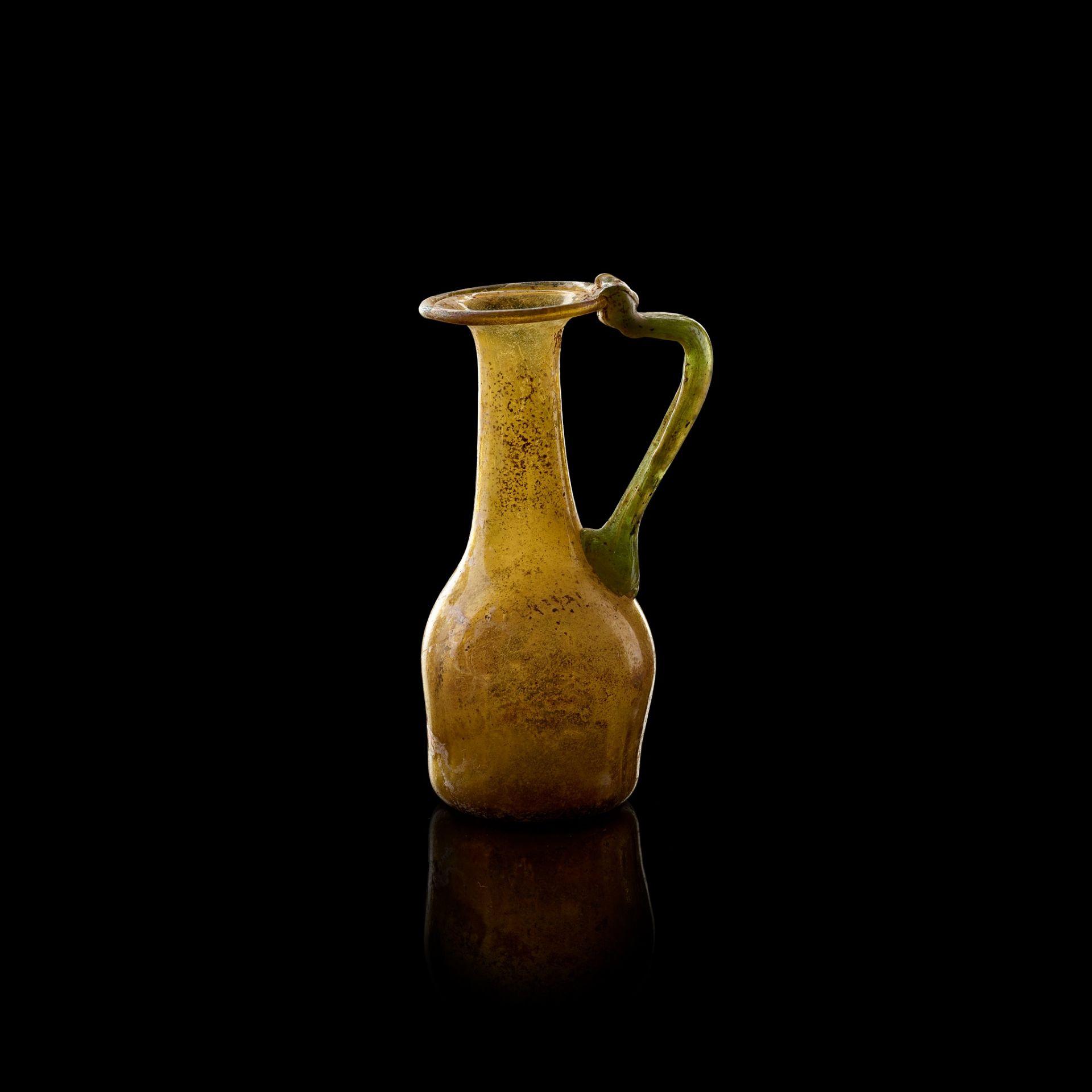 ROMAN GLASS AMBER JUG EUROPE OR NEAR EAST, 3RD - 4TH CENTURY A.D.