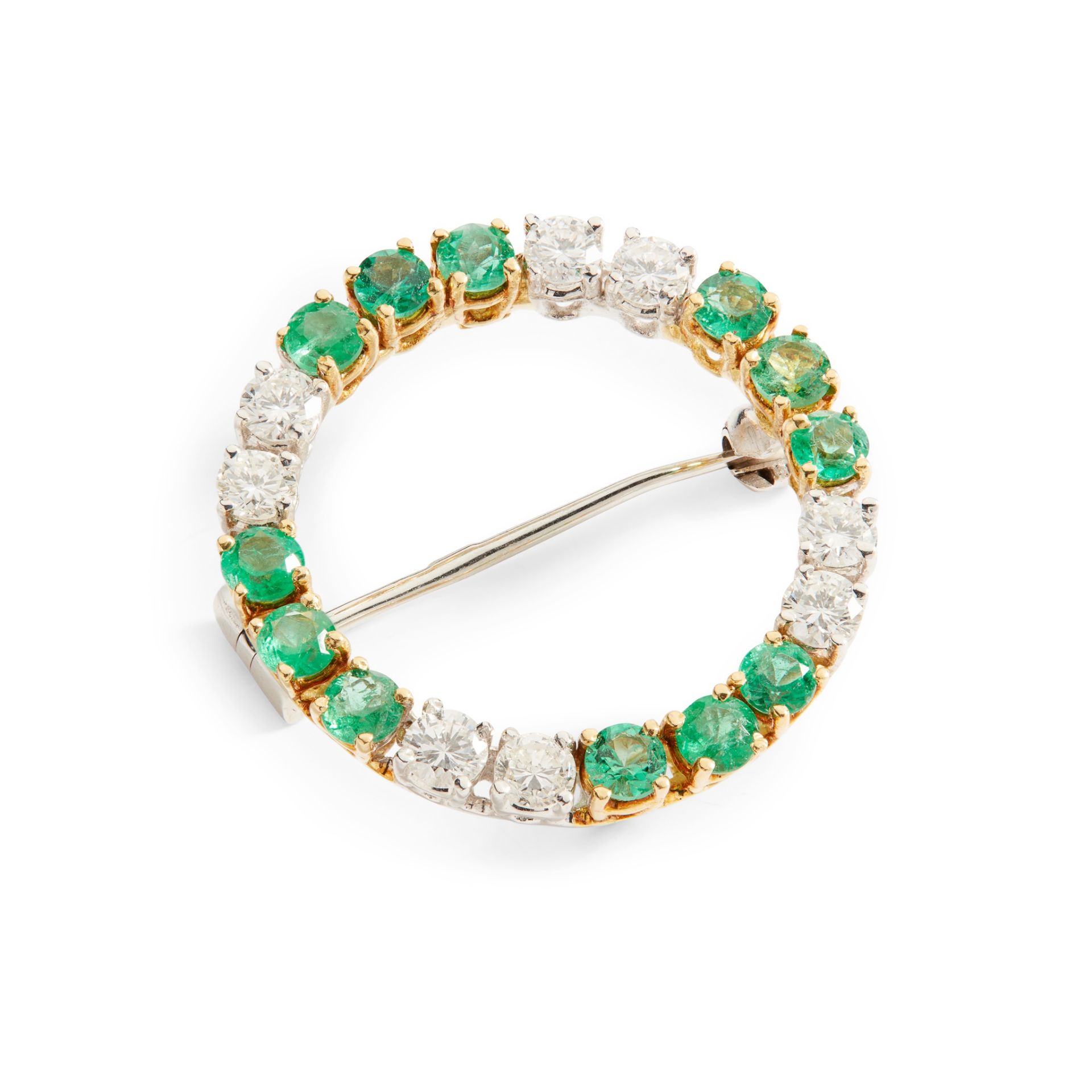 An emerald and diamond brooch