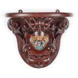 A CARVED MAHOGANY AND POLYCHROMED ARMORIAL WALL BRACKET 19TH CENTURY